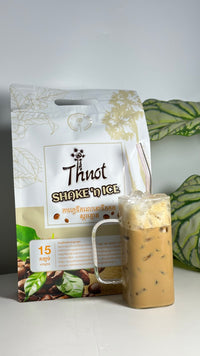 Bag of Thnot Shake'n Ice instant coffee, 15 sachets, with a glass of iced coffee