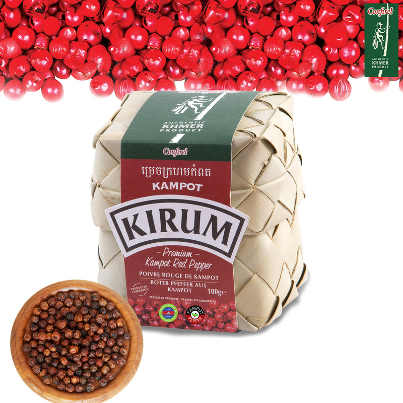 Woven palm-leaf bundle of Kirum Premium Kampot Red Pepper, 100g, with fresh and dried red peppercorns
