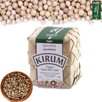 Woven palm-leaf bundle of Kirum Premium Kampot White Pepper, 100g, with white peppercorns