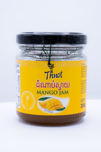 Glass jar of Thnot mango jam, 200g, with Khmer-language label