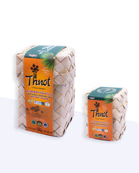 Two woven palm-leaf wrapped blocks of Thnot Kampong Speu organic sugar, large and small sizes